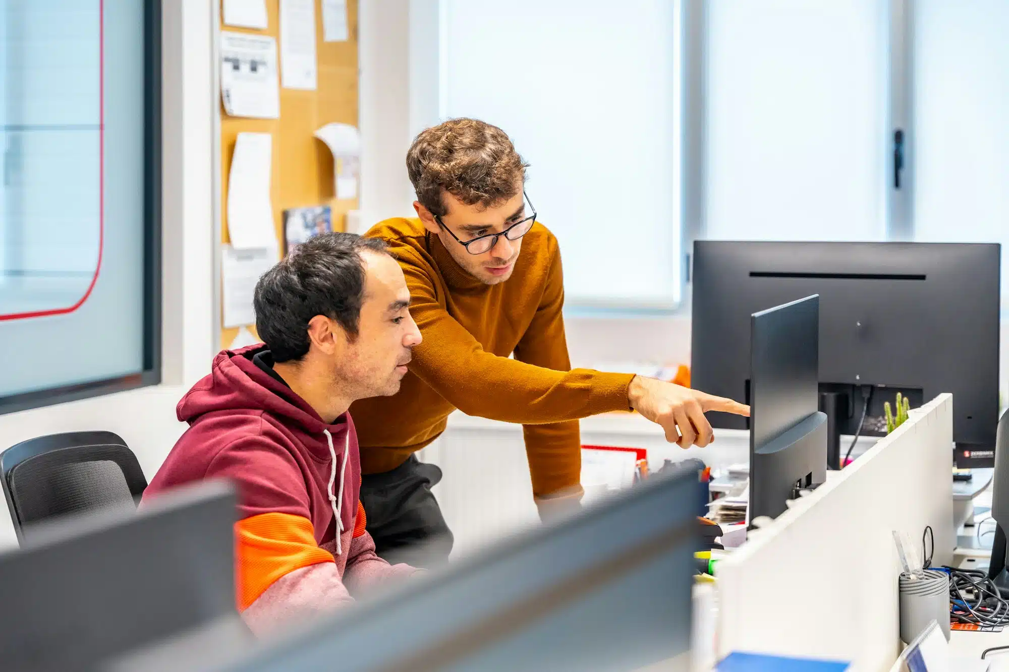 Engineers working with computer in a cnc modern factory office